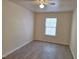 Inviting bedroom featuring a ceiling fan, a window for natural light, and durable flooring at 11711 Mezzanine Dr # 109, Raleigh, NC 27614