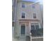 Charming townhome featuring a quaint covered entrance and well-maintained front yard at 11711 Mezzanine Dr # 109, Raleigh, NC 27614