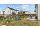 Expansive backyard with a playground, patio with seating, and plenty of space for outdoor enjoyment at 118 Lockhaven Dr, Garner, NC 27529