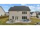 Large backyard featuring a patio with outdoor dining, a grill, and a well-maintained lawn at 118 Lockhaven Dr, Garner, NC 27529