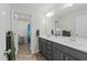 Bathroom featuring double sinks, a mirror, and an opened door to the shower at 118 Lockhaven Dr, Garner, NC 27529