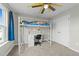 Bedroom featuring a bunk bed with a desk and a yellow ceiling fan at 118 Lockhaven Dr, Garner, NC 27529