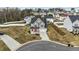 Charming two-story home featuring a well-manicured front yard and a welcoming red front door at 118 Lockhaven Dr, Garner, NC 27529