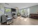 Bright living room with light wood flooring, stylish sofas, and modern decor at 118 Lockhaven Dr, Garner, NC 27529