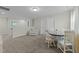Open living room with neutral carpeting, a dining area, and a comfortable seating space at 118 Lockhaven Dr, Garner, NC 27529