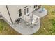 Aerial view of a concrete patio area furnished with an outdoor dining set and grill, perfect for entertaining at 118 Lockhaven Dr, Garner, NC 27529