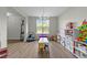 Bright playroom with natural light from a large window, and a variety of toys and storage at 118 Lockhaven Dr, Garner, NC 27529