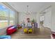 Bright playroom with natural light from a large window, and a variety of toys and storage at 118 Lockhaven Dr, Garner, NC 27529