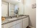 Bathroom featuring dual sinks, granite countertops and decorative accents at 1253 Manor Dr, Rocky Mount, NC 27804