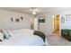 Calm bedroom featuring neutral décor, white linens, and easy access to ensuite at 1253 Manor Dr, Rocky Mount, NC 27804