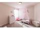 Bright bedroom featuring a charming toddler bed with pink canopy and carpeted floors at 1253 Manor Dr, Rocky Mount, NC 27804