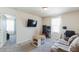 Bright bedroom featuring a gaming setup, comfortable sofa, and plush carpet at 1253 Manor Dr, Rocky Mount, NC 27804