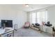 Bright home office with white walls, plush carpet, and ample natural light at 1253 Manor Dr, Rocky Mount, NC 27804