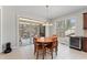Dining area with sliding glass doors to the outdoor patio and natural light at 12812 Baybriar Dr, Raleigh, NC 27613