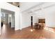 Dining room with hardwood floors, wainscoting, coffered ceiling, and transitional chandelier at 12812 Baybriar Dr, Raleigh, NC 27613