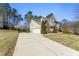 Two-story home with solar panels, well-manicured yard, and a three-car garage with a long driveway at 12812 Baybriar Dr, Raleigh, NC 27613