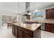 Spacious kitchen features an island with granite countertops and stainless steel appliances at 12812 Baybriar Dr, Raleigh, NC 27613