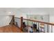 Bright living room with large windows, fireplace, and staircase with wooden railing at 12812 Baybriar Dr, Raleigh, NC 27613