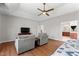 Open main bedroom showcasing wood floors, sitting area, and en-suite bath access at 12812 Baybriar Dr, Raleigh, NC 27613
