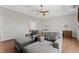 Large main bedroom with wood floors and sitting area near window at 12812 Baybriar Dr, Raleigh, NC 27613