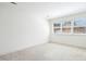 Spacious bedroom with neutral carpeting and large windows allowing abundant natural light at 1309 Langdon Pl, Pittsboro, NC 27312