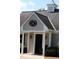 Close-up of building exterior featuring decorative lighting fixtures and peaked roof at 1309 Langdon Pl, Pittsboro, NC 27312
