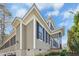Charming home exterior featuring detailed trim, a cozy porch, and manicured landscaping at 1309 Langdon Pl, Pittsboro, NC 27312