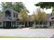 Exterior view of shops, showcasing well-maintained facades, landscaping, and accessible parking at 1309 Langdon Pl, Pittsboro, NC 27312
