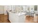 Bright kitchen with stainless steel appliances, a sink, and white cabinetry at 1309 Langdon Pl, Pittsboro, NC 27312