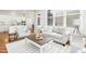 Inviting living room with a comfortable sofa, stylish chairs, and hardwood floors at 1309 Langdon Pl, Pittsboro, NC 27312