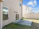 Siding with a window, sliding glass door, and a small concrete patio at 1445 Lombar St, Raleigh, NC 27610