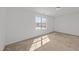 Bright bedroom with neutral carpet, large window offering natural light, and ample space at 1445 Lombar St, Raleigh, NC 27610