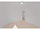 Cozy bedroom with neutral carpeting, a large closet, and an adjacent doorway at 1445 Lombar St, Raleigh, NC 27610