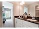 This modern bathroom features double sinks, granite countertops, and bright lighting at 150 Green Haven Blvd # 67, Youngsville, NC 27596