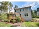 Spacious two-story home with a deck, screened porch, well-manicured lawn, and mature trees at 150 Green Haven Blvd # 67, Youngsville, NC 27596