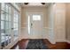 Elegant foyer with hardwood floors, paneled walls, and a front door with glass accents at 150 Green Haven Blvd # 67, Youngsville, NC 27596