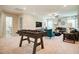 Spacious game room with foosball table, comfortable seating, ceiling fan and ample lighting at 150 Green Haven Blvd # 67, Youngsville, NC 27596