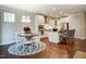 Bright and airy kitchen with white cabinets, stainless steel appliances, and breakfast bar at 150 Green Haven Blvd # 67, Youngsville, NC 27596