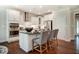 Modern kitchen with stainless steel appliances, white cabinetry, and granite countertops at 150 Green Haven Blvd # 67, Youngsville, NC 27596