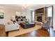 Cozy living room featuring a stone fireplace, hardwood floors, and neutral decor at 150 Green Haven Blvd # 67, Youngsville, NC 27596