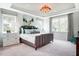 Elegant main bedroom with tray ceiling, custom drapery, and plush carpeting at 150 Green Haven Blvd # 67, Youngsville, NC 27596