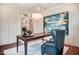 Stylish office with dark desk, upholstered chair, art, and bright lighting at 150 Green Haven Blvd # 67, Youngsville, NC 27596