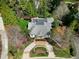 Expansive aerial view of estate home showing the brick driveway and mature landscaping at 1925 Banbury Rd, Raleigh, NC 27608