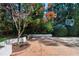 Charming brick patio with a basketball court and mature trees for shade at 1925 Banbury Rd, Raleigh, NC 27608