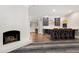 This bar features custom cabinetry, a wine fridge, and a quartz countertop at 1925 Banbury Rd, Raleigh, NC 27608