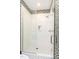 Modern shower with black and white tile and geometric patterned walls at 1925 Banbury Rd, Raleigh, NC 27608