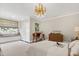 Bright bedroom with a cozy window seat, stylish decor, and neutral tones at 1925 Banbury Rd, Raleigh, NC 27608