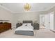 Serene bedroom with neutral tones, stylish furniture, and ample natural light at 1925 Banbury Rd, Raleigh, NC 27608