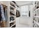 Walk-in closet with custom shelves and drawers provides ample storage at 1925 Banbury Rd, Raleigh, NC 27608