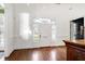 Foyer showcasing the hardwood flooring and elegant arched entryway at 1925 Banbury Rd, Raleigh, NC 27608